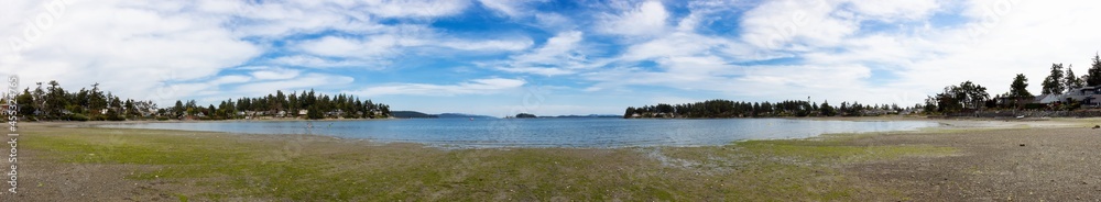 View of a scenic shore on the west coast of pacific ocean during a sunny summer day. Roberts Bay, Sidney, Vancouver Island, British Columbia, Canada.