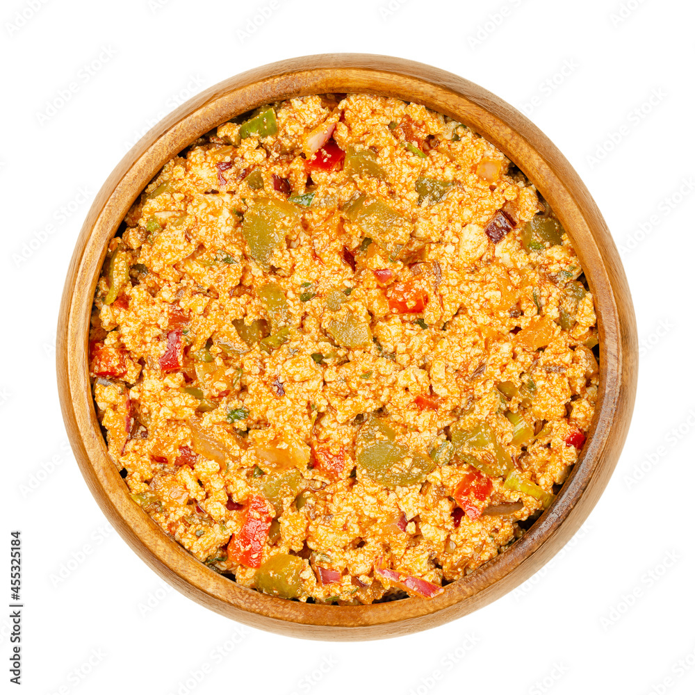 Vegan Liptauer bread spread, in a wooden bowl. Spicy spread, made of crumbled white tofu, red peppers, gherkins, onions and spices. Savory traditional Austrian-Hungarian cuisine. Close-up, from above. Vegan Liptauer bread spread, in a wooden bowl. Spicy spread, made of crumbled white tofu, red peppers, gherkins, onions and spices. Savory traditional Austrian-Hungarian cuisine. Close-up, from above.