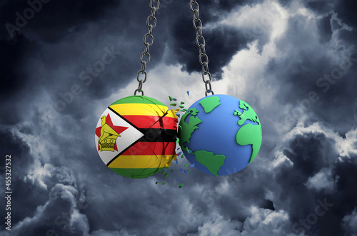 Zimbabwe flag ball smashing into planet earth. Global impact and disaster concept. 3D Render © ink drop