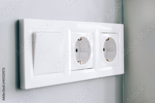 Schilderij op canvas White european electrical outlets and switch on gray wall