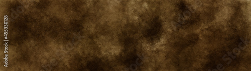 Old dark brown paper parchment background design with distressed vintage stains and ink spatter and elegant antique beige color. 