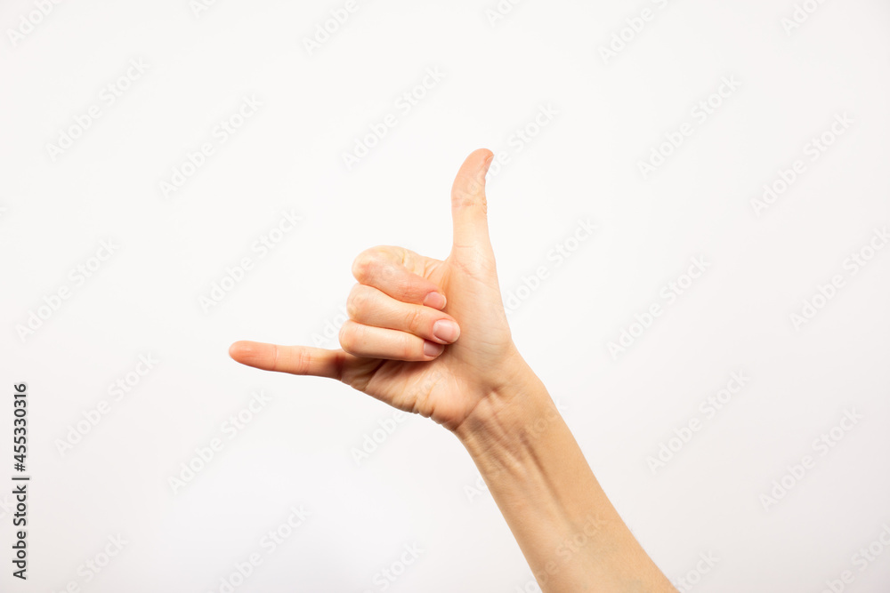 Mano señal de teléfono. Fondo blanco. Mano señal de teléfono. Fondo blanco.