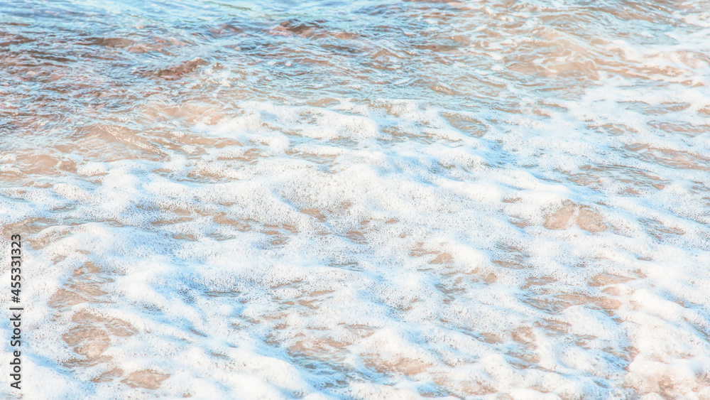 crystal clear azure water with sea foam, seascape background
