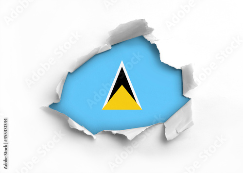 Flag of Saint Lucia underneath the ripped paper