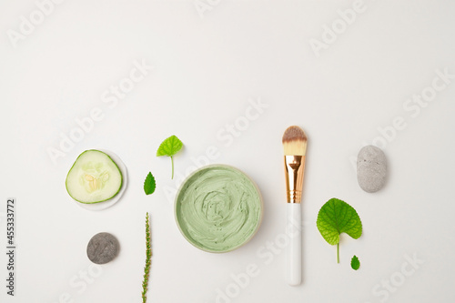 Cosmetic green cream in a jar top view background. Skin care, organic natural beauty products concept