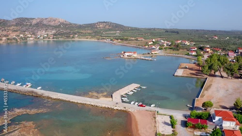 4K aerial - a bird's eye view video (Ultra High Definition) of Plitra port. Sunny morning landscape of Peloponnese peninsula, Greece, Europe. Stunning summer seascape of Ionian sea.. photo