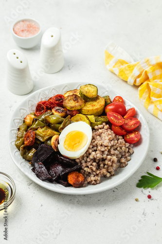 Egg buckwheat roasted veggie bowl. Space for text.