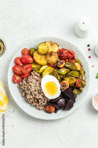 Egg buckwheat summer vegetables bowl. Space for text, top view.