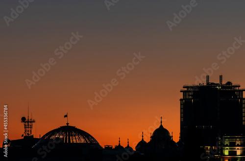 Silhouettes of buildings in the center of Kiev against the background of the sunset sky.