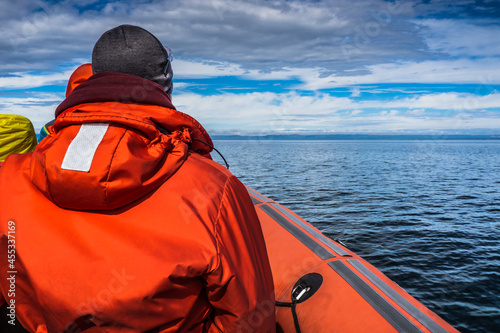 Passenger of an inflatable boat with their life jacket on whale watching cruise on Tadoussac, Quebec (Canada) © Pernelle Voyage