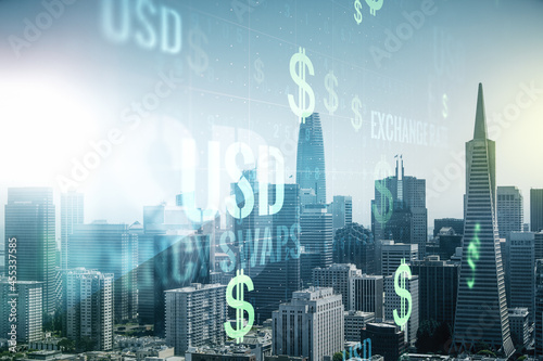 Double exposure of virtual USD symbols hologram on San Francisco city skyscrapers background. Banking and investing concept