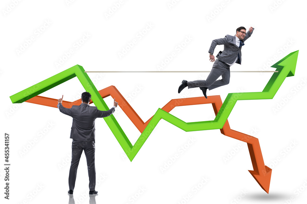 Fototapeta premium Businessman balancing on tightrope on line chart