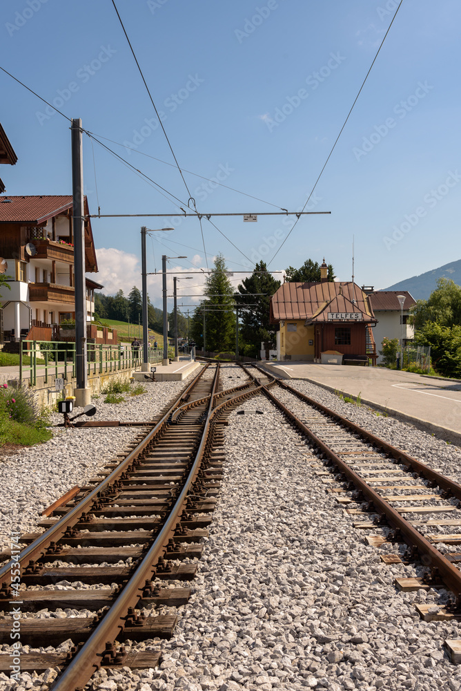 Train tracks towards the station in the city center, Telfes Im Stubai, Tyrol, Austria Train tracks towards the station in the city center, Telfes Im Stubai, Tyrol, Austria