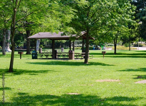 The empty picnic shelter at the park on a sunny day.
