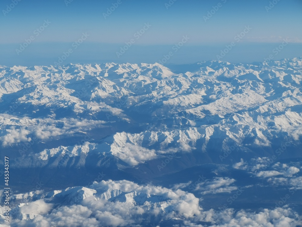aerial of snow cowered mountain range 