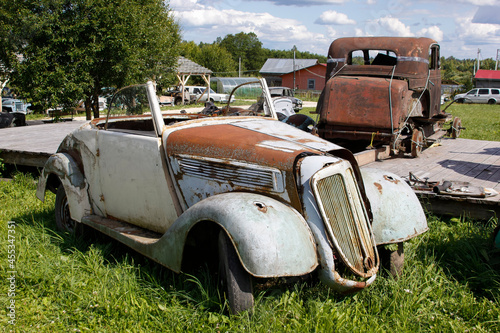 Old abandoned rusty vehicles, crushed cars in junkyard. Cars recycling concept.