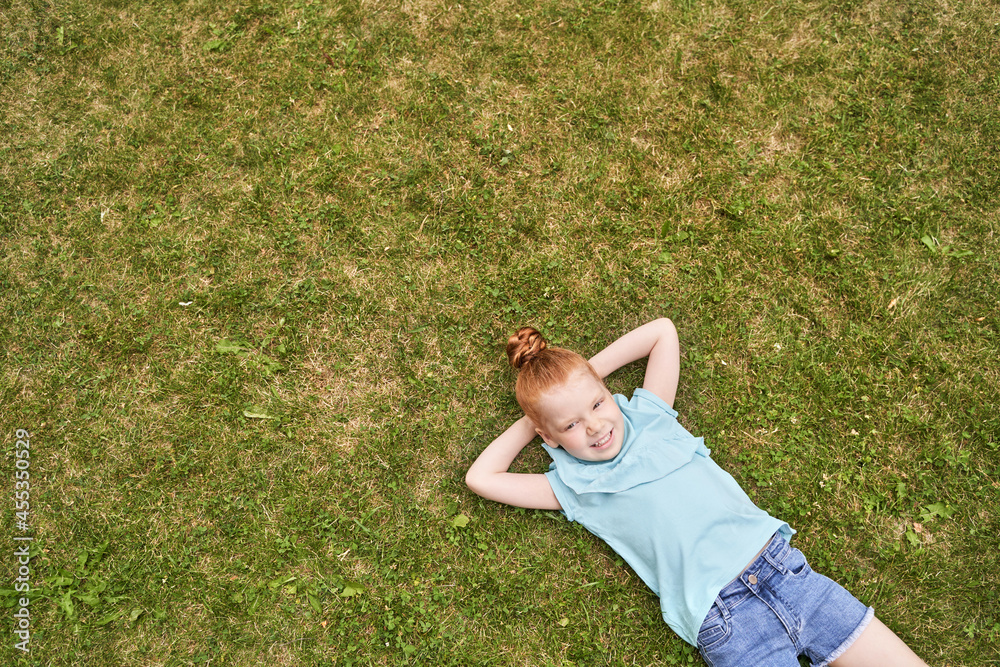 Little girl portrait. Outdoor green background. Teenager schoolgirl at ...