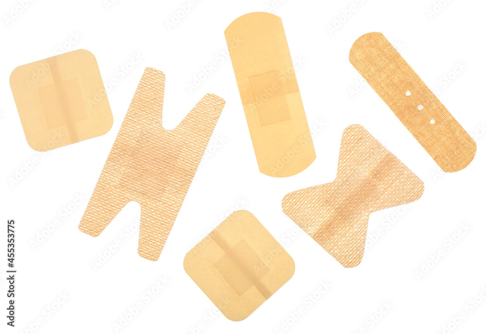Set of different adhesive bandages isolated on a white background, top view. Sticky plasters.