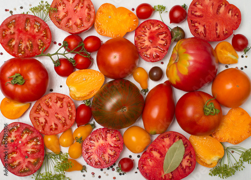 Tomatoes of different kind on white background.  Variety of colorfull tomatoes. © Polina Ponomareva
