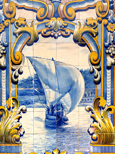 Pinhão train station tiles depicting a rabelo boat in the Douro river transporting Port Wine barrels photo