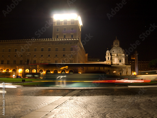 Piazza Venezia in the center of Rome at night.