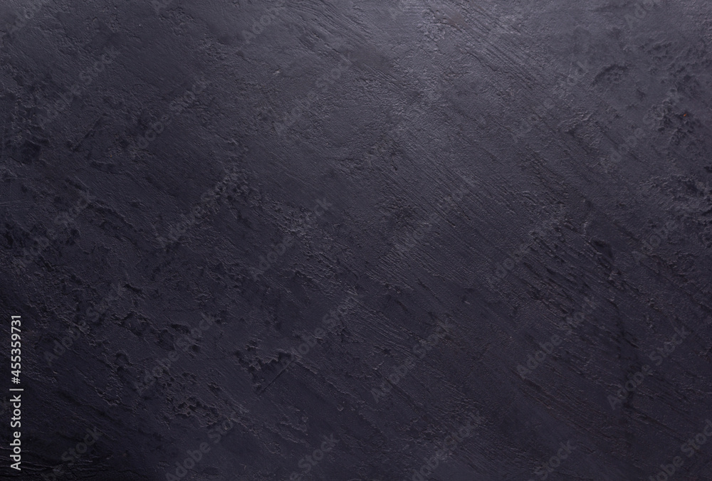 Black slate stone background texture. Putty or plaster wall Black slate stone background texture. Putty or plaster wall