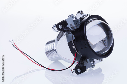 Automotive headlamp lens bi-xenon. Isolate on white background photo