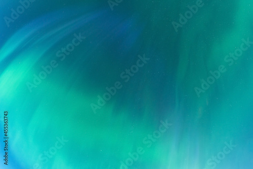 Fototapeta Naklejka Na Ścianę i Meble -  Aurora borealis, Northern green blue lights with starry in the night sky, soft blurry aurora background picture