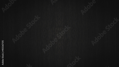 Abstract dark wooden background with a lighter center. Black wood texture background