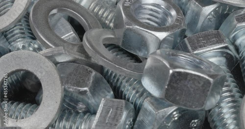 A group of bolts, nuts and washers close up. Fasteners.