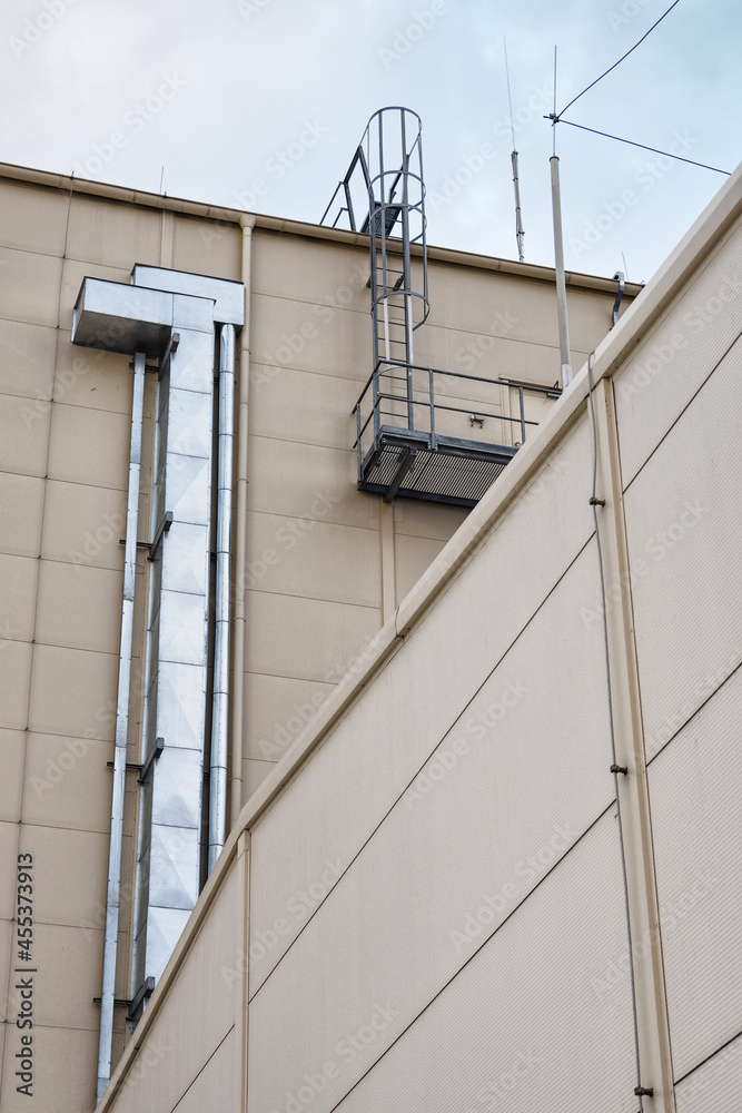 Metal gutter by the stairs on the side of the air conditioning building. Metal gutter by the stairs on the side of the air conditioning building.