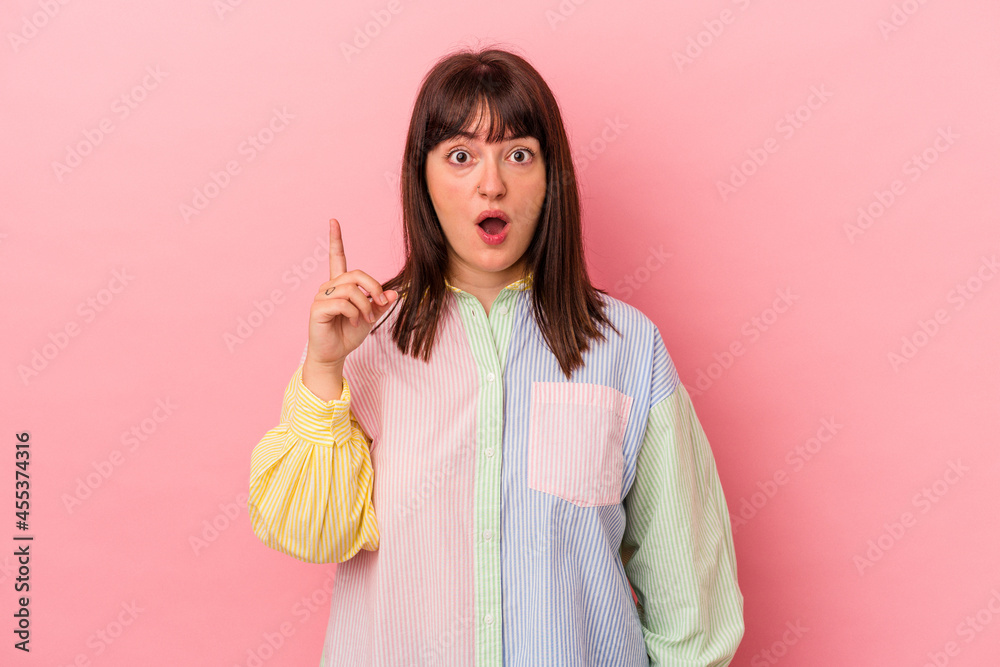 Young curvy caucasian woman isolated on pink background having an idea, inspiration concept. Young curvy caucasian woman isolated on pink background having an idea, inspiration concept.