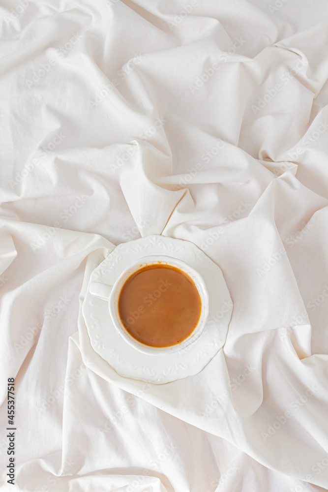 Cup of coffee with milk on white background. Cozy coffee break concept. Breakfast composition.