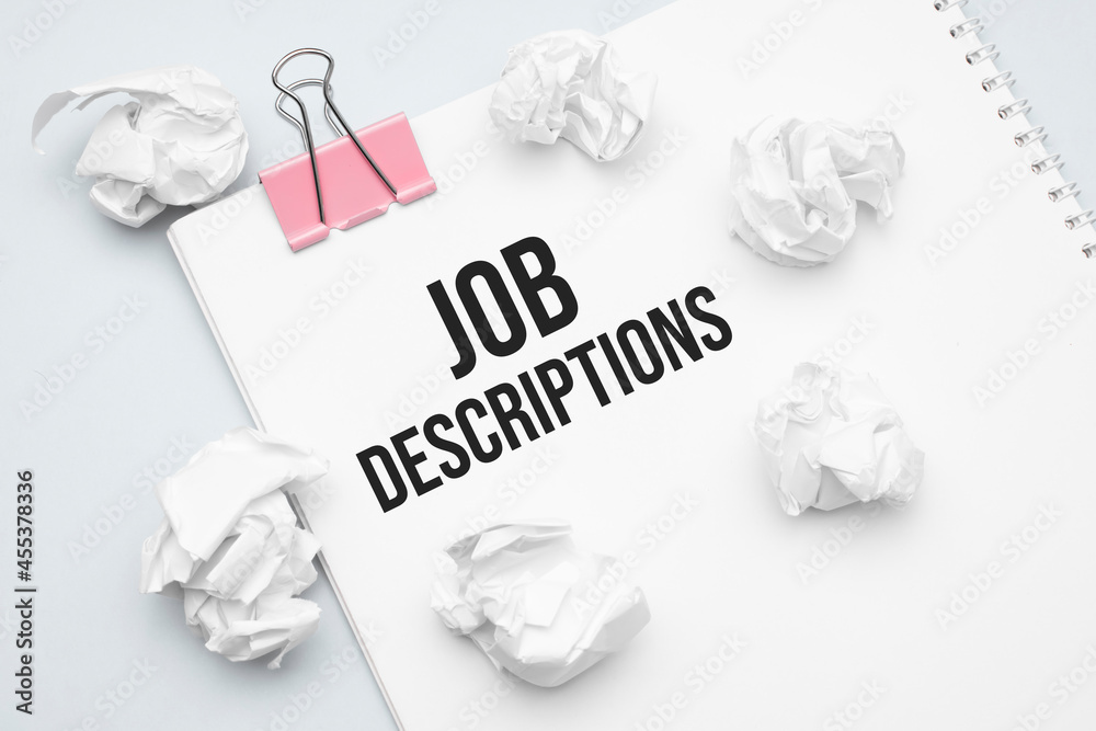 Job Descriptions. Blank sheet of paper, red paper clip, word Ideas and
