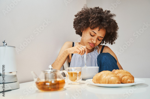 Female looking at her morning meal in disgust