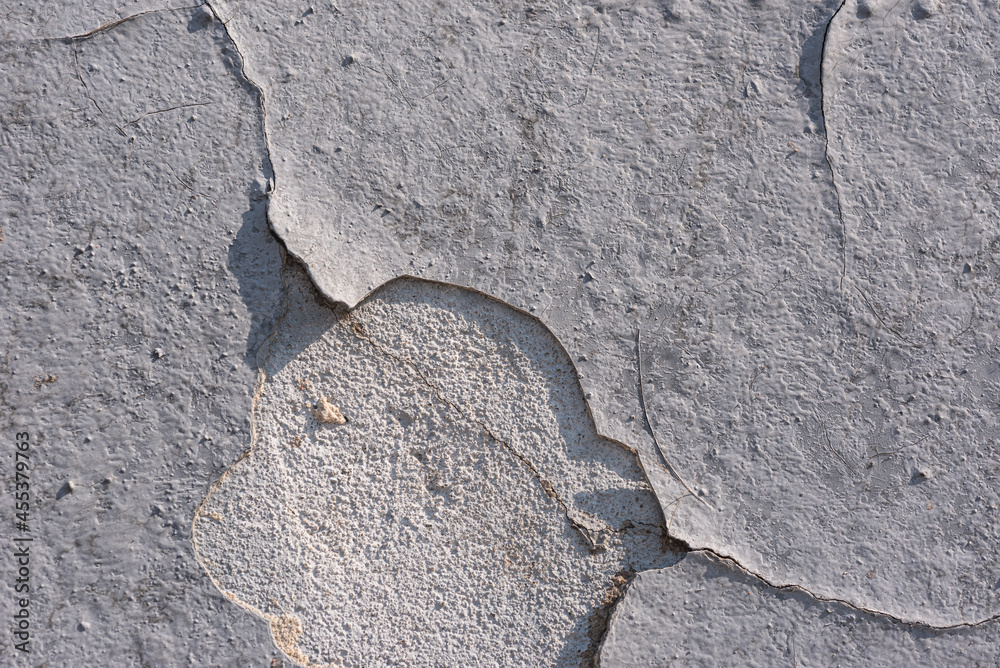 Old wall- destroyed plaster. Grainy background- cracks, chips, peeling paint Old wall- destroyed plaster. Grainy background- cracks, chips, peeling paint
