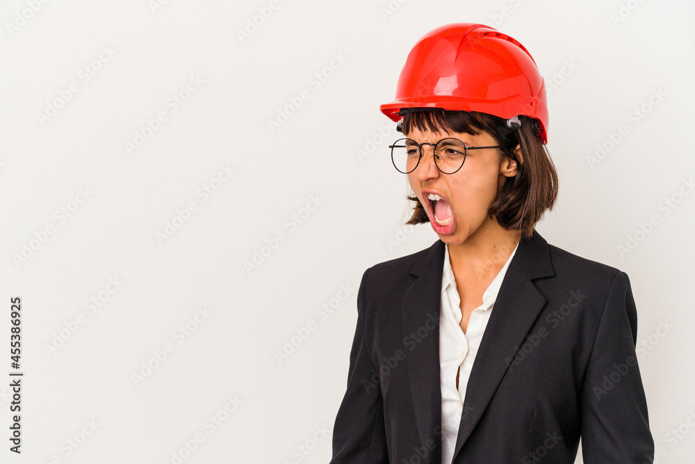 Young architect woman with red helmet isolated on white background shouting towards a copy space Young architect woman with red helmet isolated on white background shouting towards a copy space