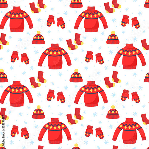 Vector winter seamless pattern with red sweater, hat, mittens and socks. Christmas pattern for fabrics, wrapping paper, scrapbooking or brand package.