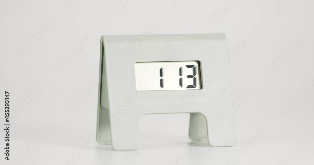 Close-up detail - Time Lapse Digital alarm clock Showtime 01.00 isolated on green background, Time lapse 2 hour. Close-up detail - Time Lapse Digital alarm clock Showtime 01.00 isolated on green background, Time lapse 2 hour.