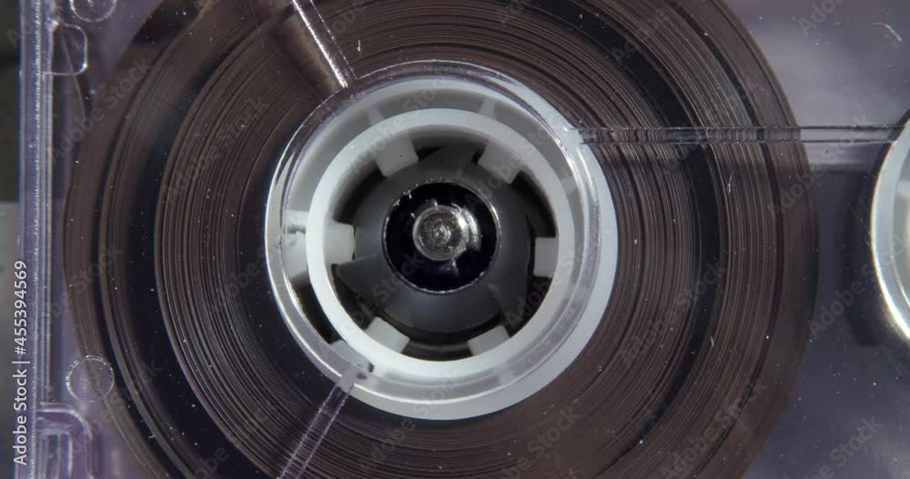 Left To Right Pan Of Microcassette Reels Turning Left To Right Pan Of Microcassette Reels Turning