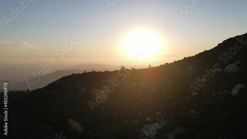 Shore of a bay or river or lake, against the background of the forest, aerial view at sunset
 photo