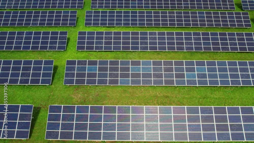 Solar panels on green field. Solar panels system power generators from sun. Clean technology for better future.	
