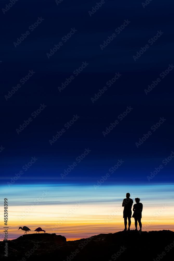 Silhouette of couple on sunset with copy space Silhouette of couple on sunset with copy space