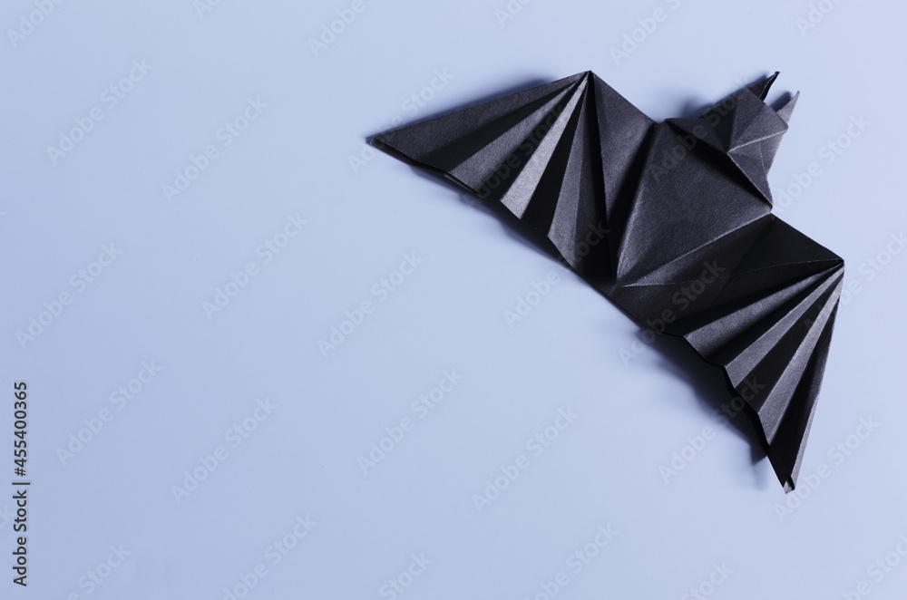 Naklejka premium Paper craft bat for the Halloween holiday. Origami Paper Toys for All Saints ' Day