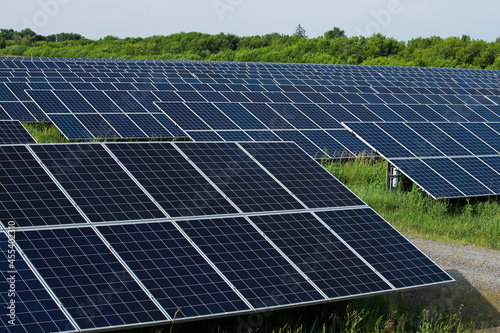 Rows of solar panels in a field. Natural energy © areporter