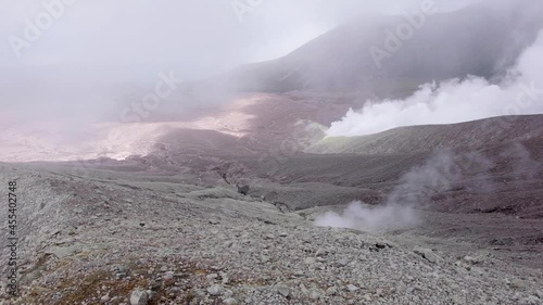 Unreal mars looking smoking volcanic terrain and landscape on Mt Balbi volcano in remote Bougainville, Papua New Guinea photo