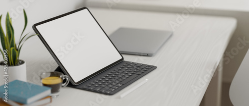 Modern minimalist workspace with portable tablet, magic keyboard, 3d rendering