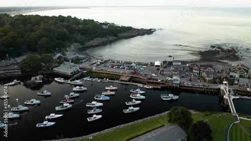 Aerial footage of shops and Perkins Cove in Ogunquit, Maine at sunset photo