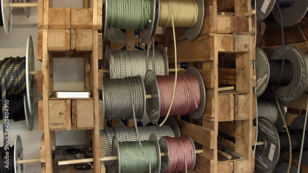 Many different bracelet strings inside of craftsman workshop, motion view Many different bracelet strings inside of craftsman workshop, motion view