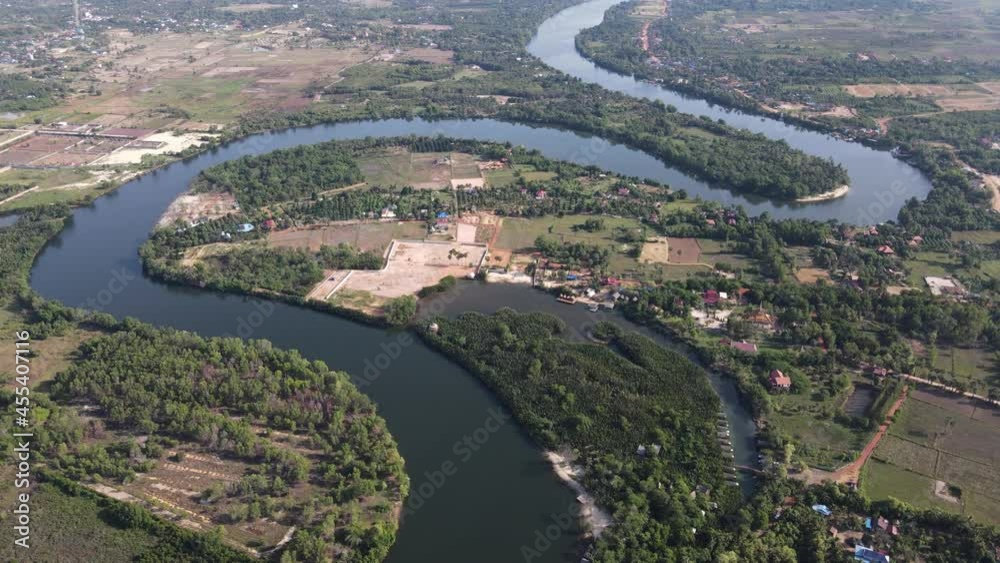 Overview of countryside of Kampot by drone, green patterns with farms along the river Overview of countryside of Kampot by drone, green patterns with farms along the river